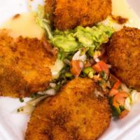 Stuffed Jalapeños · Whole jalapenos stuffed w/ chicken and monterey jack cheese, lightly breaded and fried.