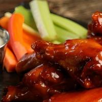 Sweet Red Chili Wings · This sauce starts off sweet, but spicy red chili peppers provide enough heat to fire up an o...