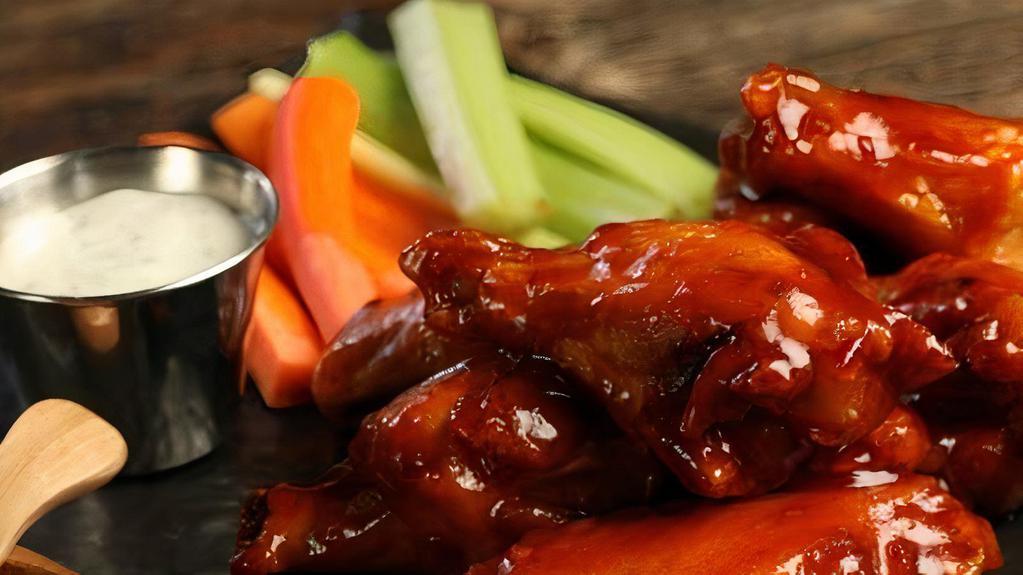 Sweet Red Chili Wings · This sauce starts off sweet, but spicy red chili peppers provide enough heat to fire up an order of wings
