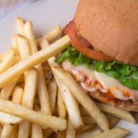 Buffalo Chicken Sandwich · A crispy fried chicken breast with spicy buffalo sauce, Swiss cheese, lettuce, tomato and a ...