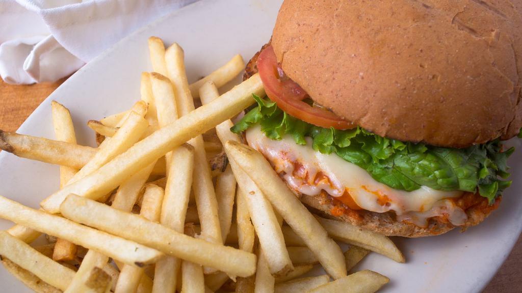 Buffalo Chicken Sandwich · A crispy fried chicken breast with spicy buffalo sauce, Swiss cheese, lettuce, tomato and a side of ranch.