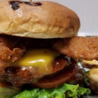 Fried Bacon Thai Burger · Grilled patty basted with sweet pepper Thai sauce topped with melted cheddar cheese and cris...