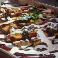 Brisket Home Slice Nacho · Fresh cut fries, tons of melted cheese, chop brisket, green onions, jalapeños, and smoked ba...