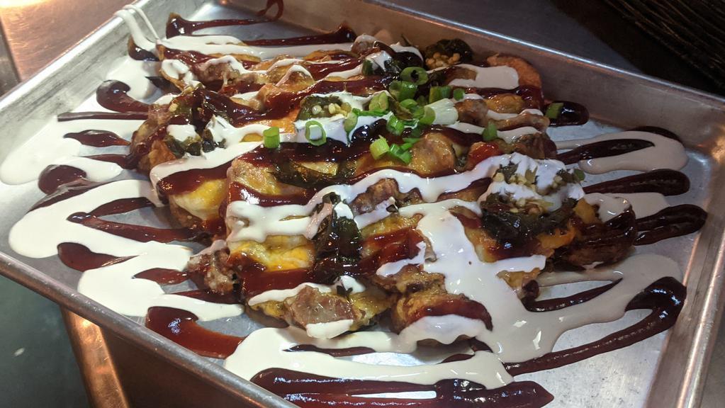 Brisket Home Slice Nacho · Fresh cut fries, tons of melted cheese, chop brisket, green onions, jalapeños, and smoked bacon. Porter BBQ and sour cream sauce.