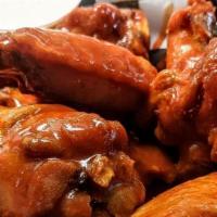 Wings - Full Order · 10/29 - OUT of Mango Hab. 
Ten wings tossed in your favorite sauce.  Your choice of sauce (S...