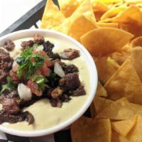 Chips And Queso · House-made chips and Queso