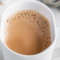 Masala Chai · Traditional Indian tea with milk and aromatic spices. (HOT)