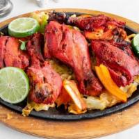Tandoori Chicken App · Chicken drumsticks mildly spiced and grilled on charcoal.
