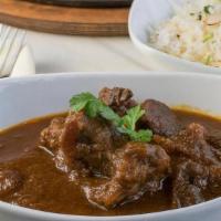 Traditional Curry · Tender choice of meat cooked in traditional curry spices. Served with long grain basmati rice.