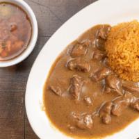 Carne Guisada Plate · Includes rice, charro beans and two tortillas.