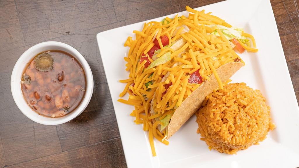 Beef Crispy Taco Plate · Two tacos, rice, and charro beans.