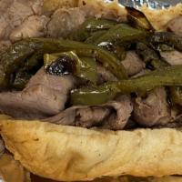 Italian Beef · Seasoned roast beef garnished with grilled sweet bell peppers, served on Chicago's artisan t...