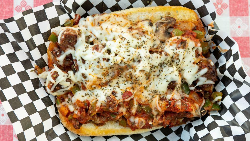 Pizza Sub · Garlic buttered amoroso open faced bun with pepperoni, Italian sausage, grilled onions, mushrooms, sweet bell peppers, marinara topped with mozzarella cheese.