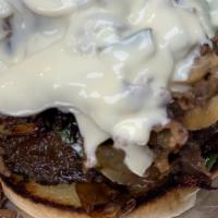 Philly Cheese Steak Burger · Half pound black Angus beef patty and four ounces of thin sliced sirloin steak served on a t...