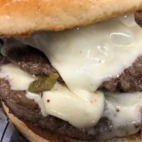 Spicy Pepper Jack Burger · Half pound black Angus beef patty served on a toasted bun topped with grilled jalapeños, Pep...