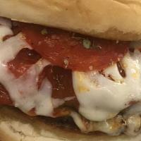 Pizza Burger · Half pound black Angus beef patty served on a toasted bun topped with marinara sauce, pepper...