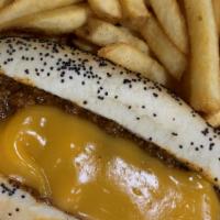 Chili Cheese Dog  · Smothered in beef chili and cheddar cheese sauce on a Vienna poppy-seed bun.
