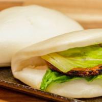 Pork Bun (2) / ポーク · A steamed buns filled with pork chashu, mayo, lettuce.