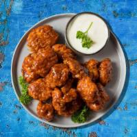 Boneless Buffalo Chicken Wings (10 Pcs) · Boneless chicken wings with a choice of your favorite wing style. Served with blue cheese or...