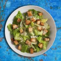 Caesar Salad · Crispy romaine lettuce and croutons dressed in lemon juice, olive oil, egg, Worcestershire s...