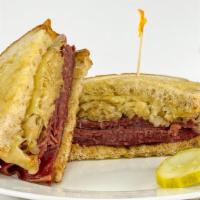 Ultimate Rueben · Your choice of hot corned beef brisket, oven roasted turkey breast, or pastrami with sauerkr...
