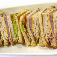 Super Club · Triple decker on white or wheat toast with oven roasted turkey breast, Black Forest ham Swis...