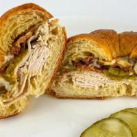 Santa Fe Turkey Melt · Hot oven roasted turkey breast, green chilies, crispy bacon and muenster cheese on a toasted...