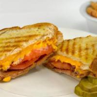 Grilled Cheese · Cheddar cheese and Monterrey Jack cheese on grilled white or wheat Texas toast.  Served with...