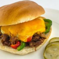 Andre'S Dream Creation · Steak-n-cheese topped with a fried egg, grilled bell peppers, and onions, topped with melted...