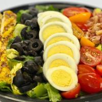 Cobb Salad · Mix of green lettuce, tomato, avocado, hard-boiled egg, black olives, and bacon with a choic...