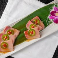 Yellowtail Heaven · 6 pcs of yellowtail sashimi served with jalapeno, green onion, spicy sriracha, and ponzu sau...