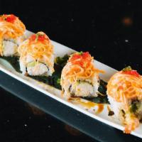Red Dragon · Spicy. Shrimp tempura, crab meat, and avocado inside topped with shredded crab stick mixed w...