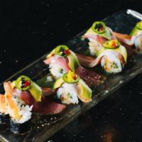 Sensation · Spicy. Shrimp tempura, cucumber, and seasoned rice inside topped with ahi tuna, salmon belly...