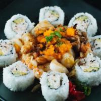 Dynamite · California roll topped with crawfish, scallop, mushroom, and onion baked with mayo, served w...