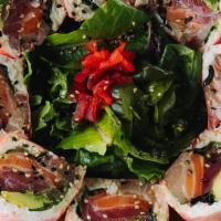 Beautiful Lady · Ahi tuna, salmon, yellowtail, crab meat, spring mix, and avocado wrapped with seaweed, serve...