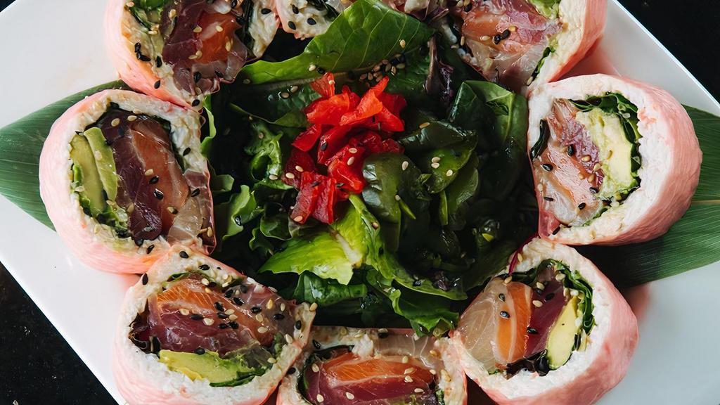 Beautiful Lady · Ahi tuna, salmon, yellowtail, crab meat, spring mix, and avocado wrapped with seaweed, served with yuzu sauce.