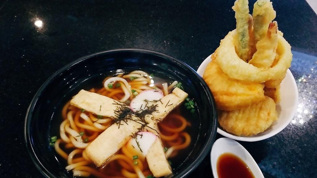 Tempura Udon · Traditional Japanese noodle soup with shrimp and vegetable tempura.