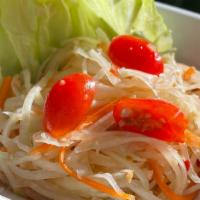 Som Tum (Thai Papaya Salad) · Shredded papaya, carrots, tomatoes, ground peanuts, Thai lime dressing