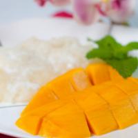 Mango Sticky Rice · Traditional Thai Dessert - fresh mango served with sweet, sticky rice and coconut milk