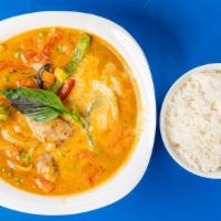 Red Curry · Bamboo shoots, peas, carrots, bell peppers, basil leaves; served with rice.