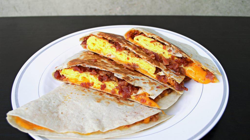 Breakfast Quesadilla · Flour tortilla with Cheddar cheese, eggs and bacon