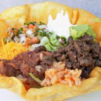 Ultimate Taco Salad · Deep fried tortilla filled with your choice of meat, rice, refried beans, lettuce, Cheddar c...