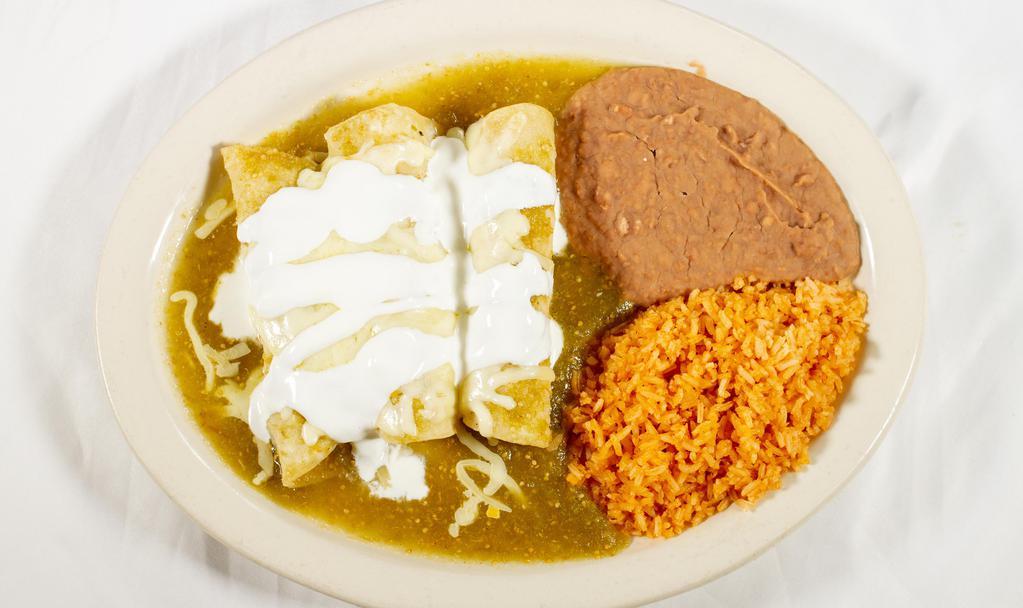 Enchiladas Verdes · Gluten-free. Three chicken enchiladas topped with tomatillo sauce, while cheese, sour cream and served with rice and beans.