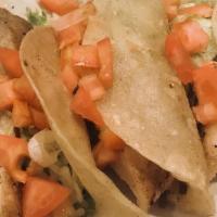 Fish Tacos · Gluten-free. Three corn tortillas filled with tender tilapia drizzled with chipotle sauce an...