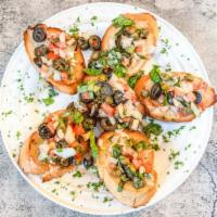 Bruschetta · Tomatoes, capers, onions, black olives, garlic, basil & olive oil.