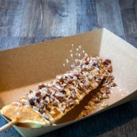 Pecan Waffle Pop · Waffle on a stick with pecans and chocolate