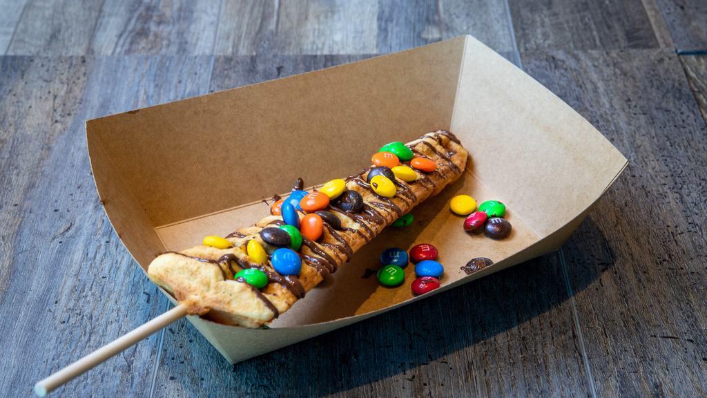 M&M Waffle Pop · Waffle on a stick with M&M and chocolate