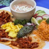 Taco Plate · 3 tacos, rice and refried beans.
