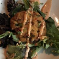 Crab Cakes (2) · Served on a bed of mixed green salad & pink sauce