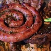 Argentinian Mixed Grilled Meat Platter (Parrillada Mixta Argentina) · Grilled combination of entraña, short ribs, chorizos, morcillas, salchicha parrillera, molle...